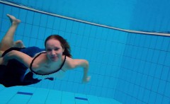 Teen girl Avenna is swimming in the pool