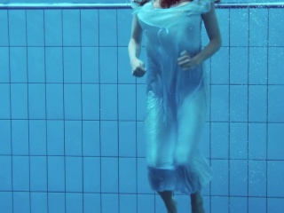 Hot teen unterwasser swims and strips