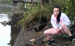 Raven Haired Girl Pees Near The River