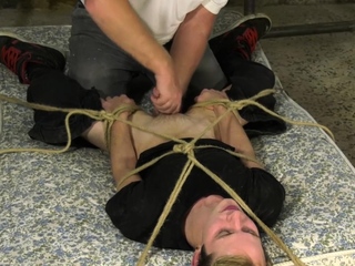 Restrained sub tormented with candle wax while ass fucked