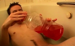 Piss loving young man playing with his cock in a bubble bath